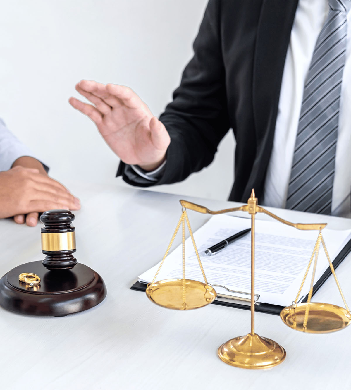 A lawyer and client discussing legal matters in an office